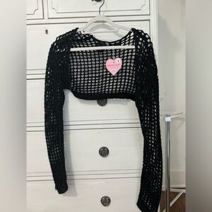 Trendy cropped cardigan with open front also called a shrug